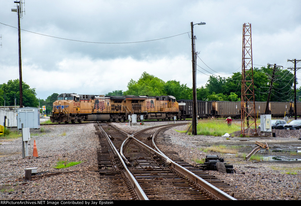 A southbound coal train slams the diamonds 